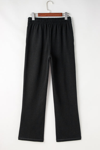 Cozy black fleece-lined casual pants with adjustable drawstring waist