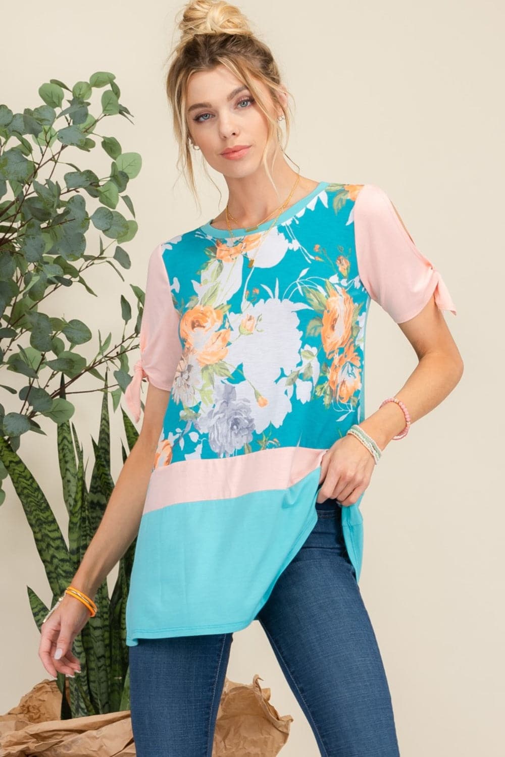 Celeste floral contrast tunic top with open tie sleeves and vibrant floral print.