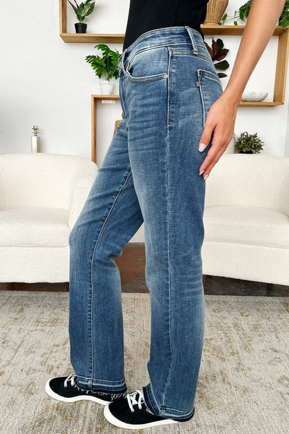 Trendy mid-rise release hem jeans by Judy Blue