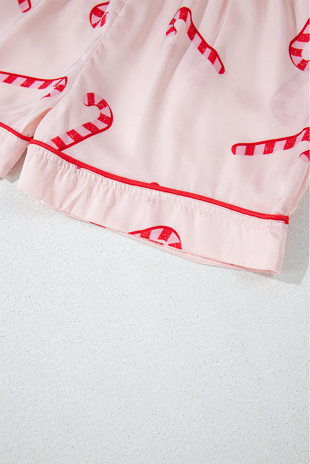 Pink candy cane print holiday pajama set with shirt and shorts