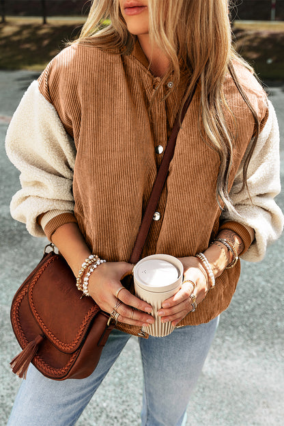 Buckskin corduroy fleece bomber jacket with faux shearling sleeves and snap button front.