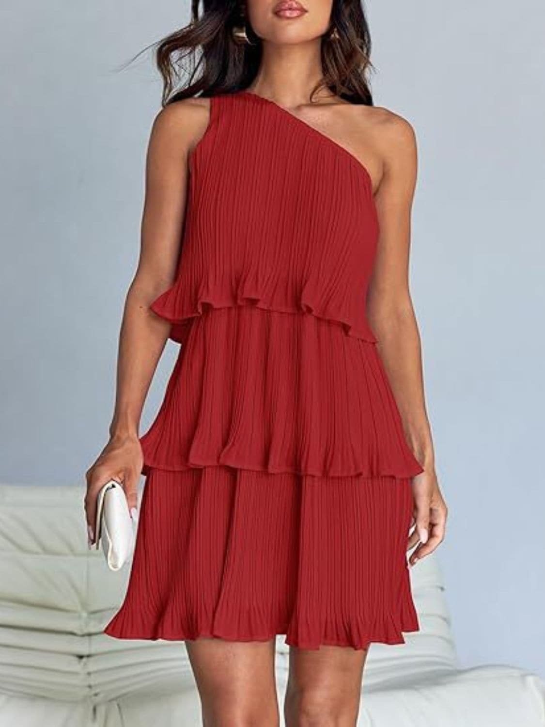 Chic sheer mini dress with ruffles in red, featuring layered design and slightly stretchy polyester fabric.