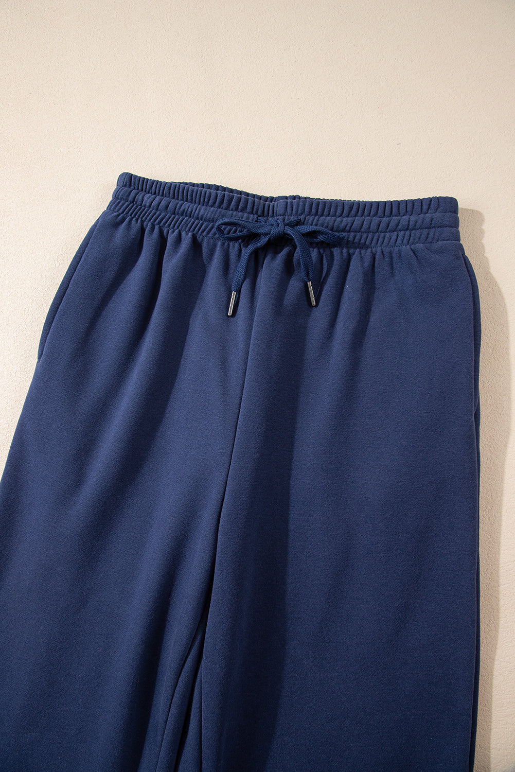 Navy blue fleece joggers with drawstring