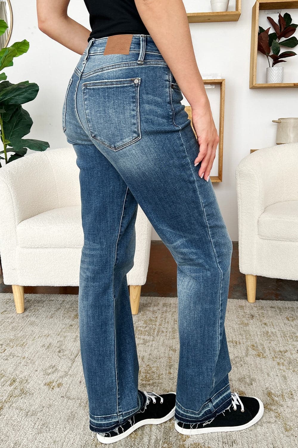 Trendy mid-rise release hem jeans by Judy Blue