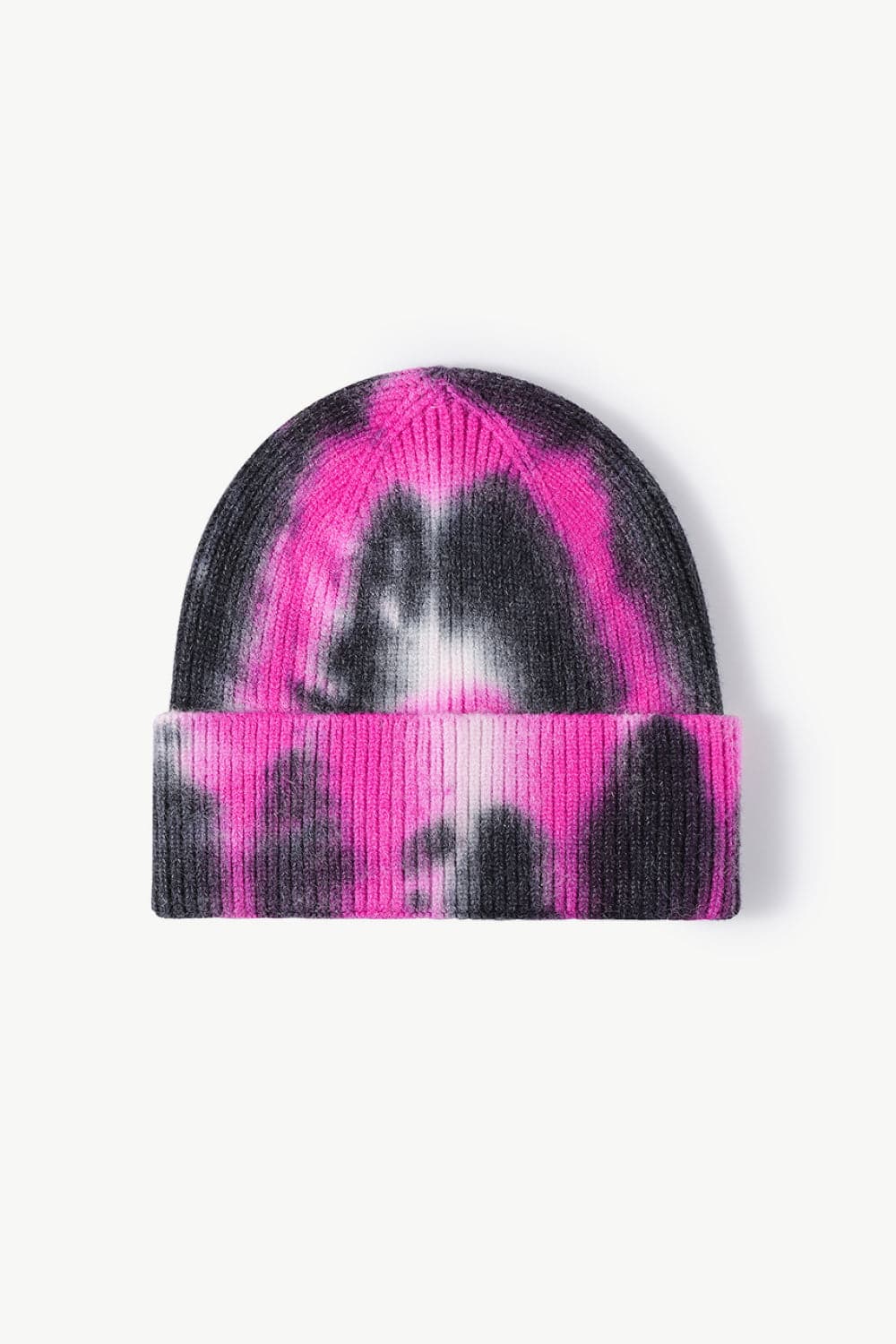 Vibrant tie-dye knit beanie with pink and black pattern, cozy winter accessory.