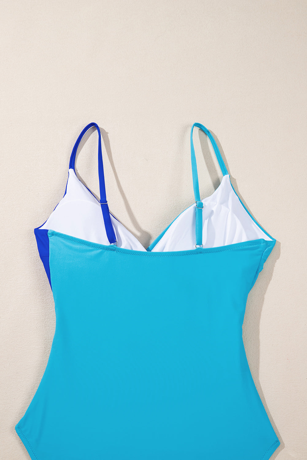 Chic light blue crossover cutout swimsuit with colorblock design