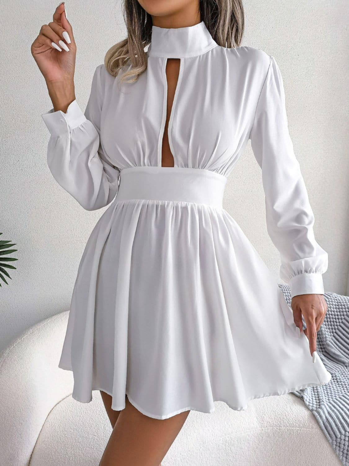 Cutout Turtleneck A-Line Mini Dress.