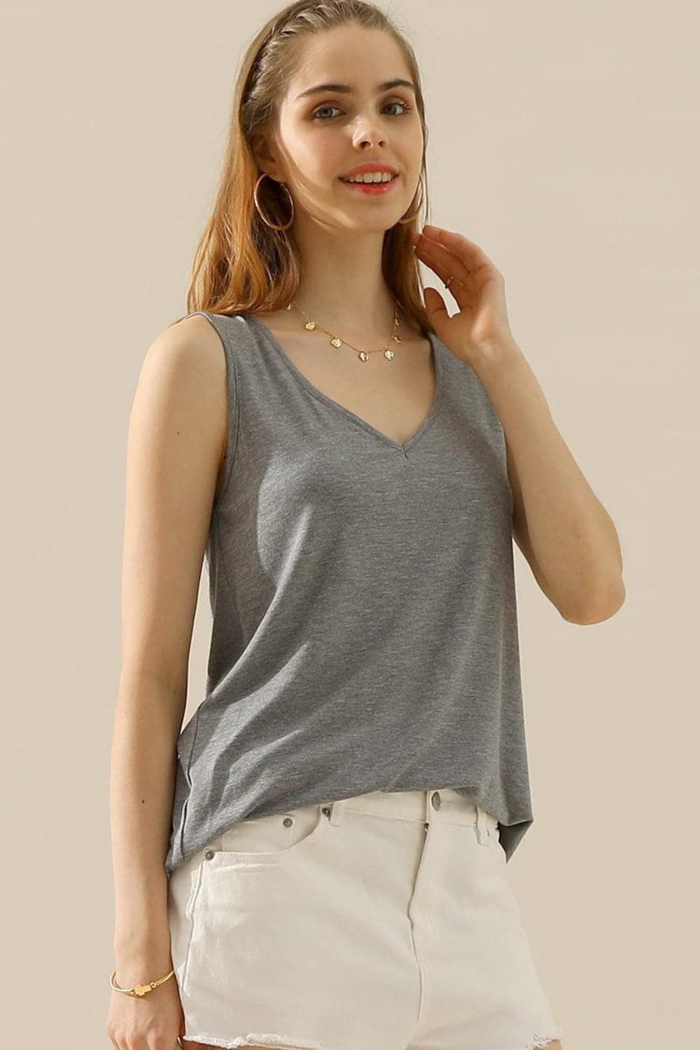 Ninexis Full Size V-Neck Curved Hem Tank.