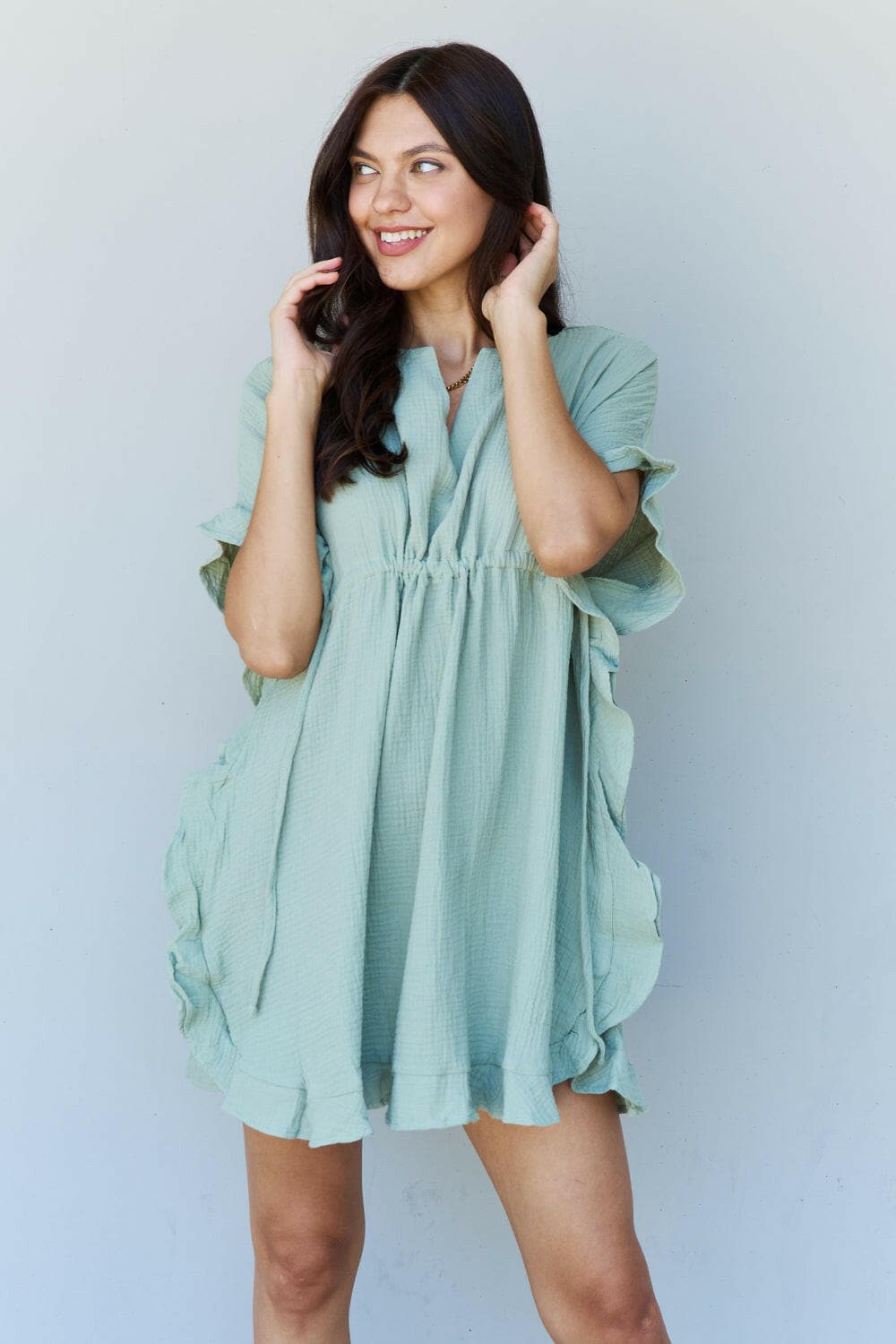 Ninexis Out Of Time Full Size Ruffle Hem Dress with Drawstring WaistbaExperience Effortless Elegance with the Ninexis Out Of Time Full Size Ruffle Hem Dress in Light Sage. This stunning dress is crafted from 100% cotton, providing a soLove Salve Time Full Size Ruffle Hem DressTIKTOK