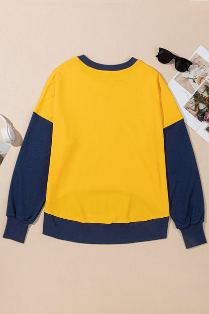 Chic yellow color block sweatshirt with thumbhole sleeves