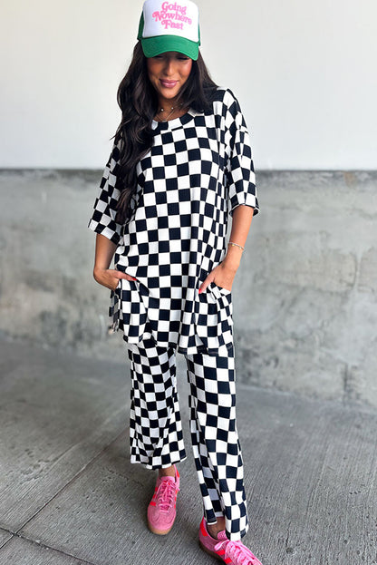 Chic black checkered tunic top and flared pant ensemble