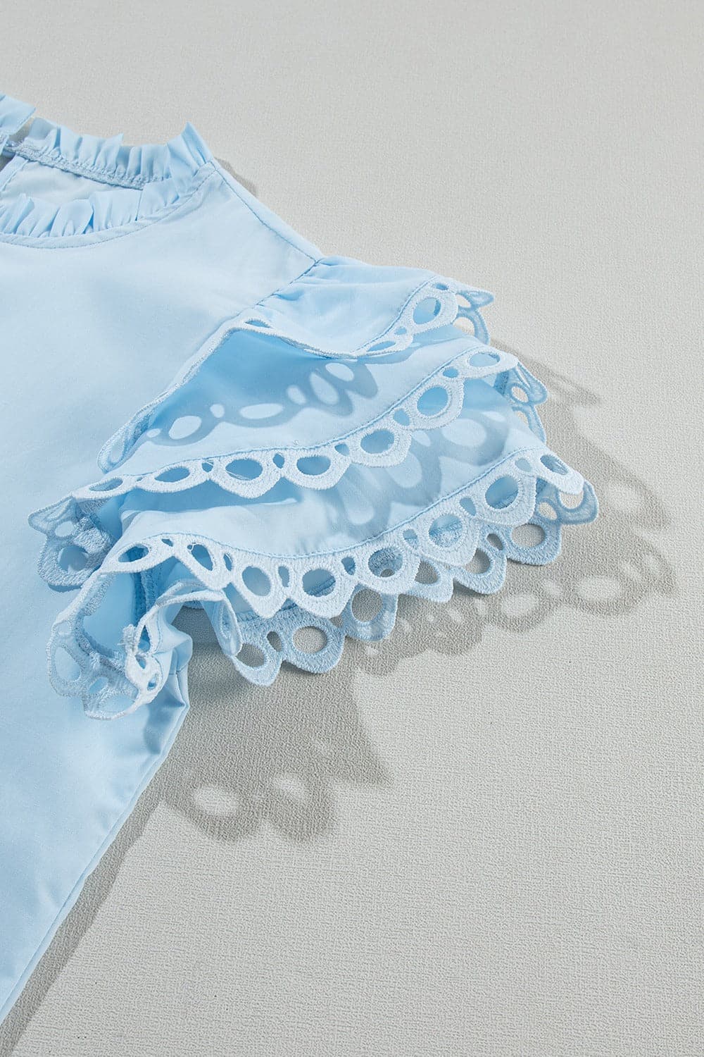 Ruffled Eyelet Round Neck Cap Sleeve Blouse.