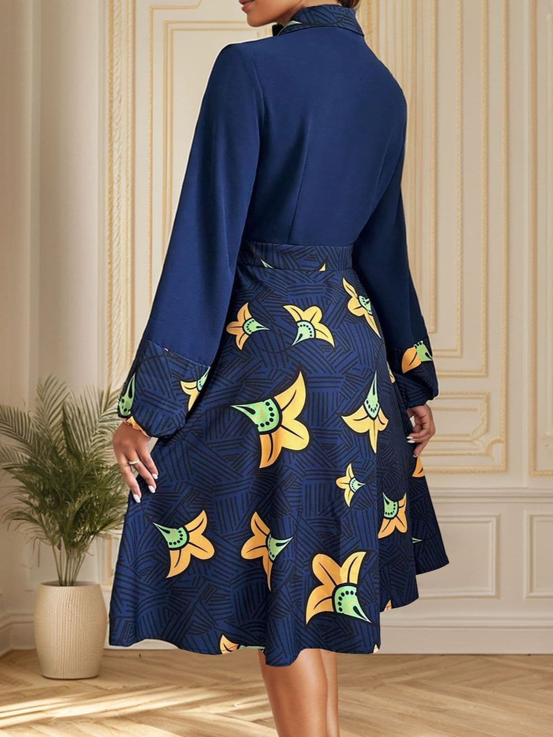 Chic collared long sleeve dress with floral pattern in navy, buttoned, 100% polyester.