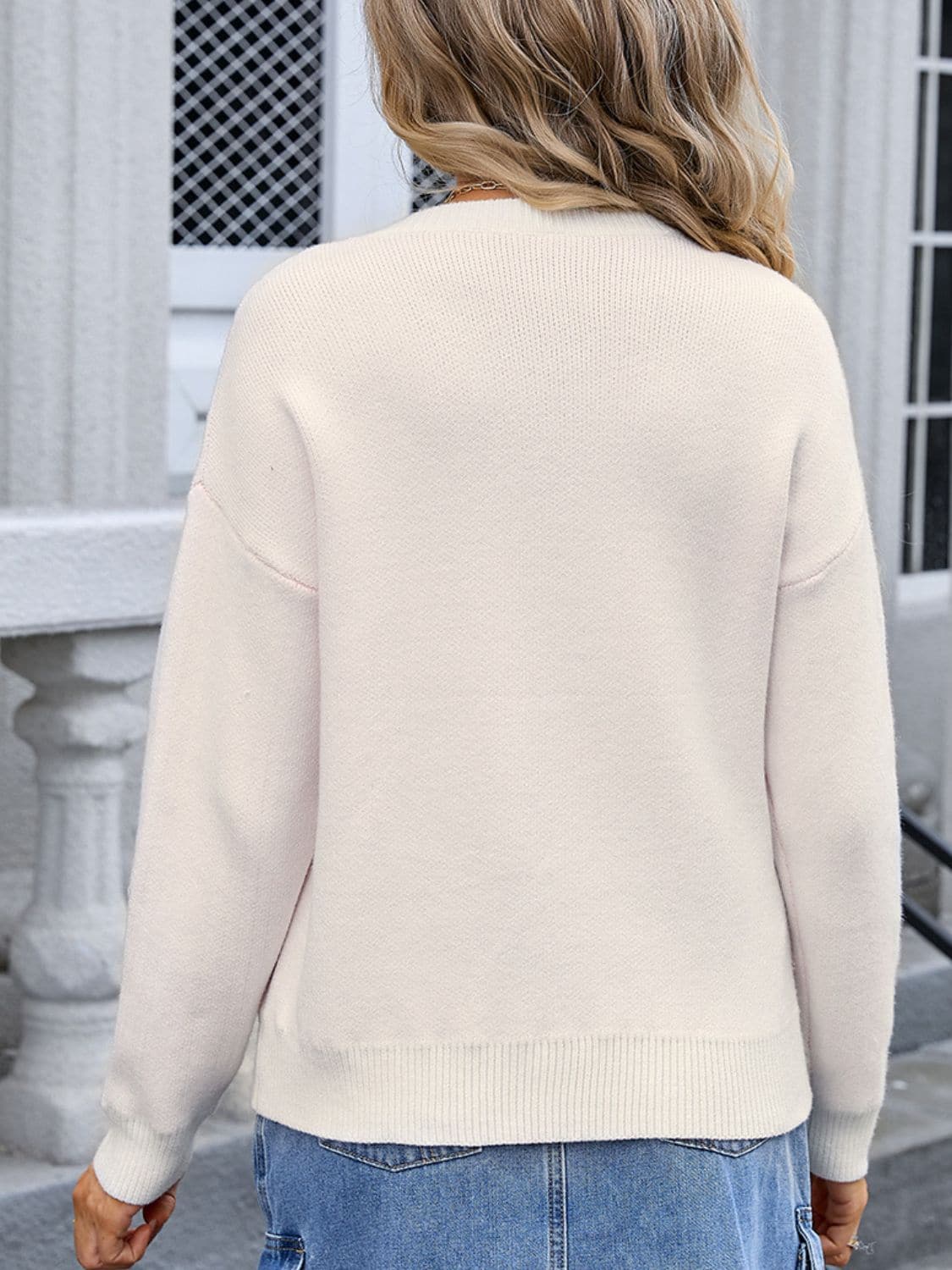 Bow Graphic Round Neck Long Sleeve Sweater.