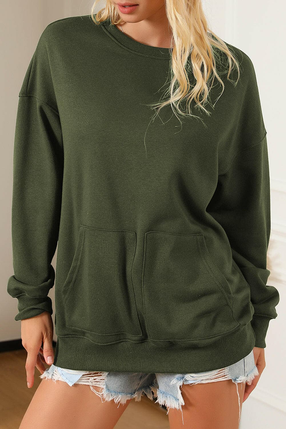 Pocketed Round Neck Dropped Shoulder Sweatshirt.