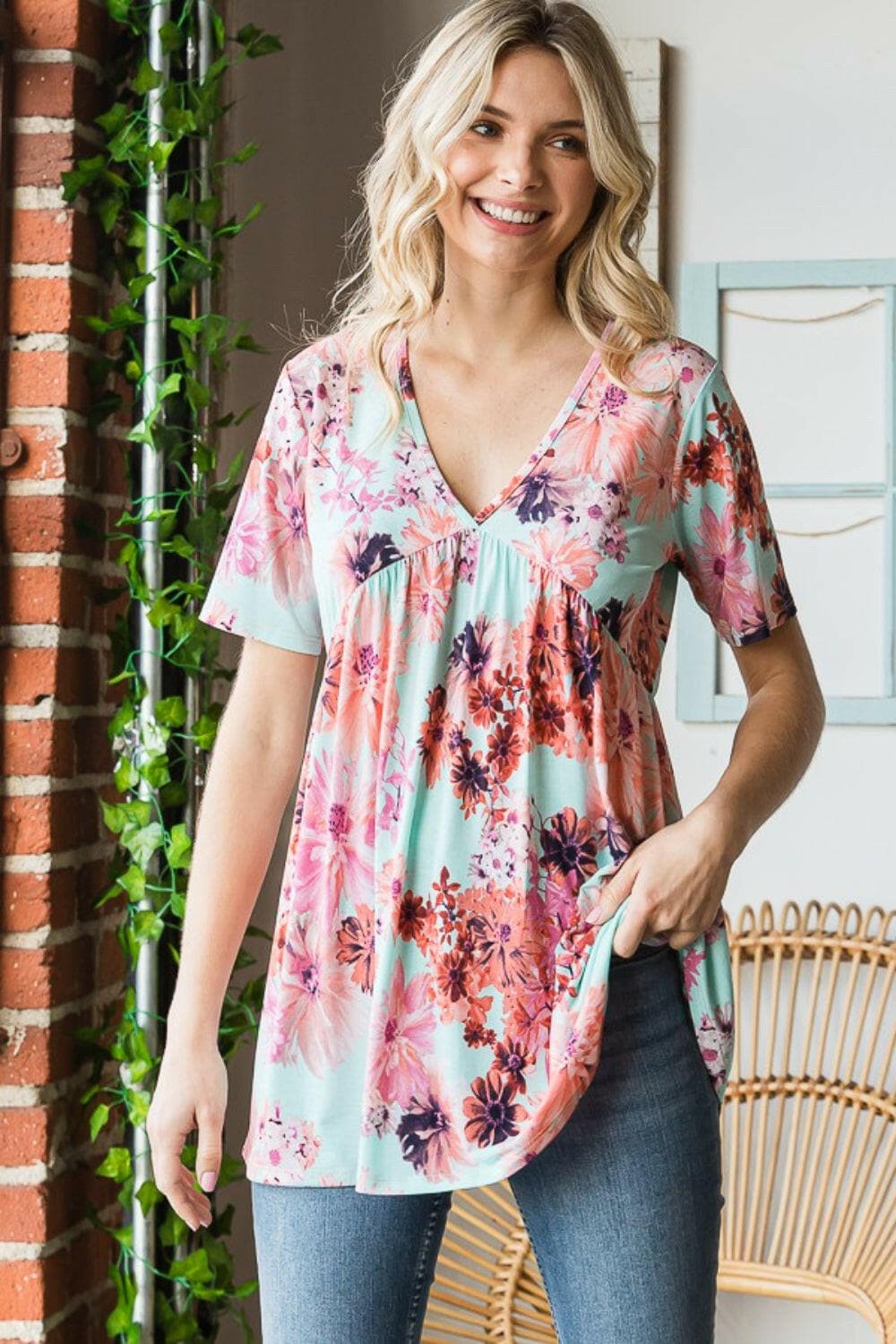 Heimish Full Size Floral V-Neck Short Sleeve Babydoll Blouse.