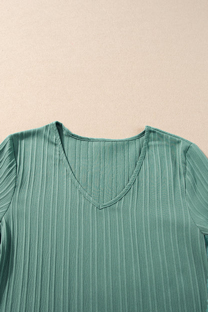 Chic grass green ruffled top with half sleeves and v-neck detail