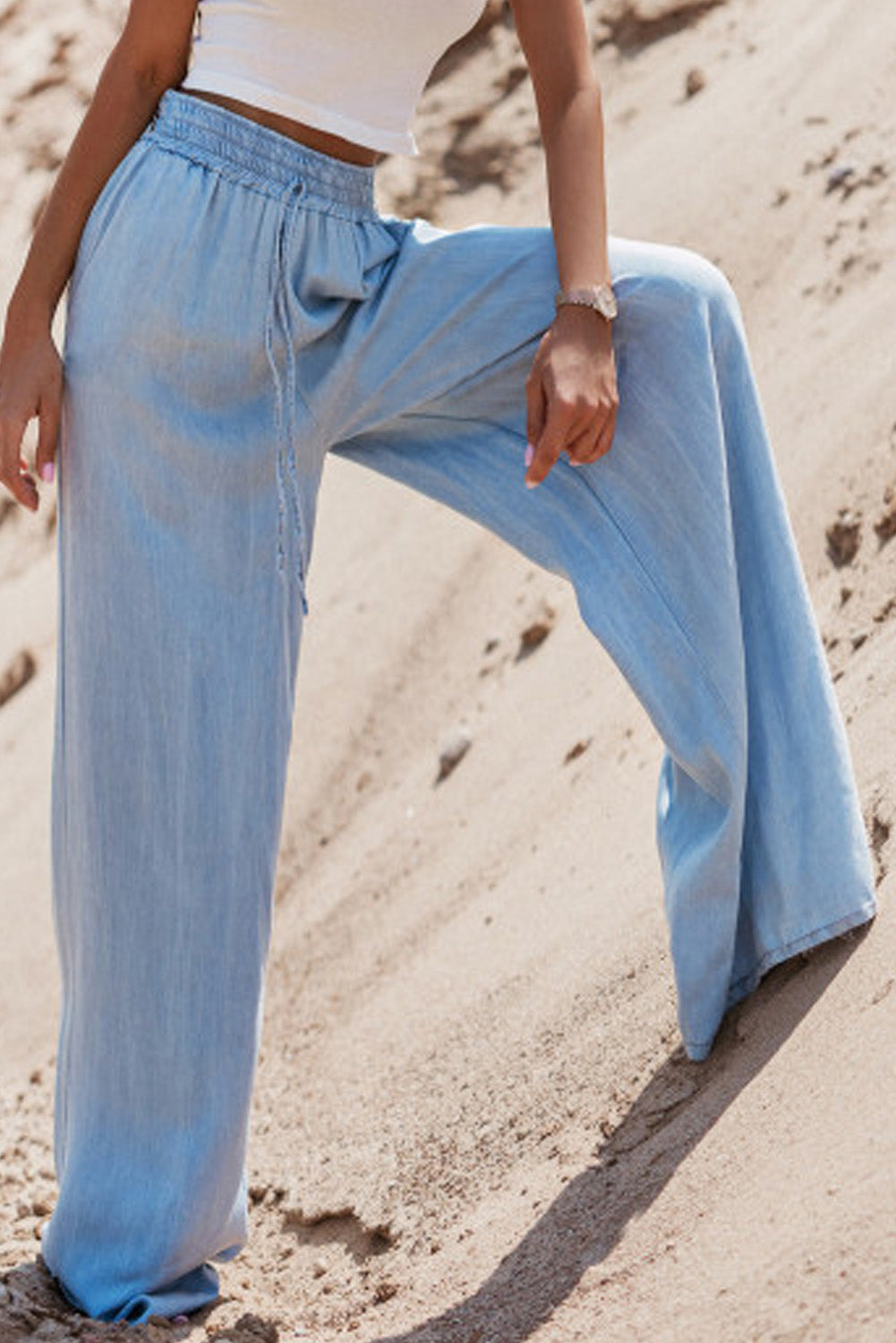 Myosotis high-waisted wide-leg denim trousers with drawstring detail