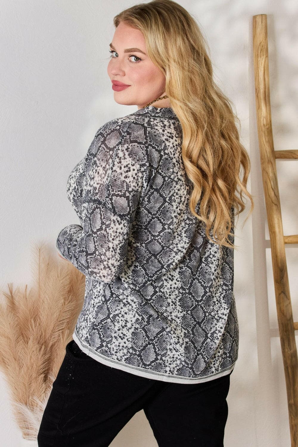 Hailey & Co Full Size Snakeskin V-Neck Long Sleeve TopStep Into the Spotlight with Hailey &amp; Co
 Embrace your boldness and stay on trend with the Hailey &amp; Co Full Size Snakeskin V-Neck Long Sleeve Top. This stunnLove Salve -Neck Long Sleeve Topcloseout