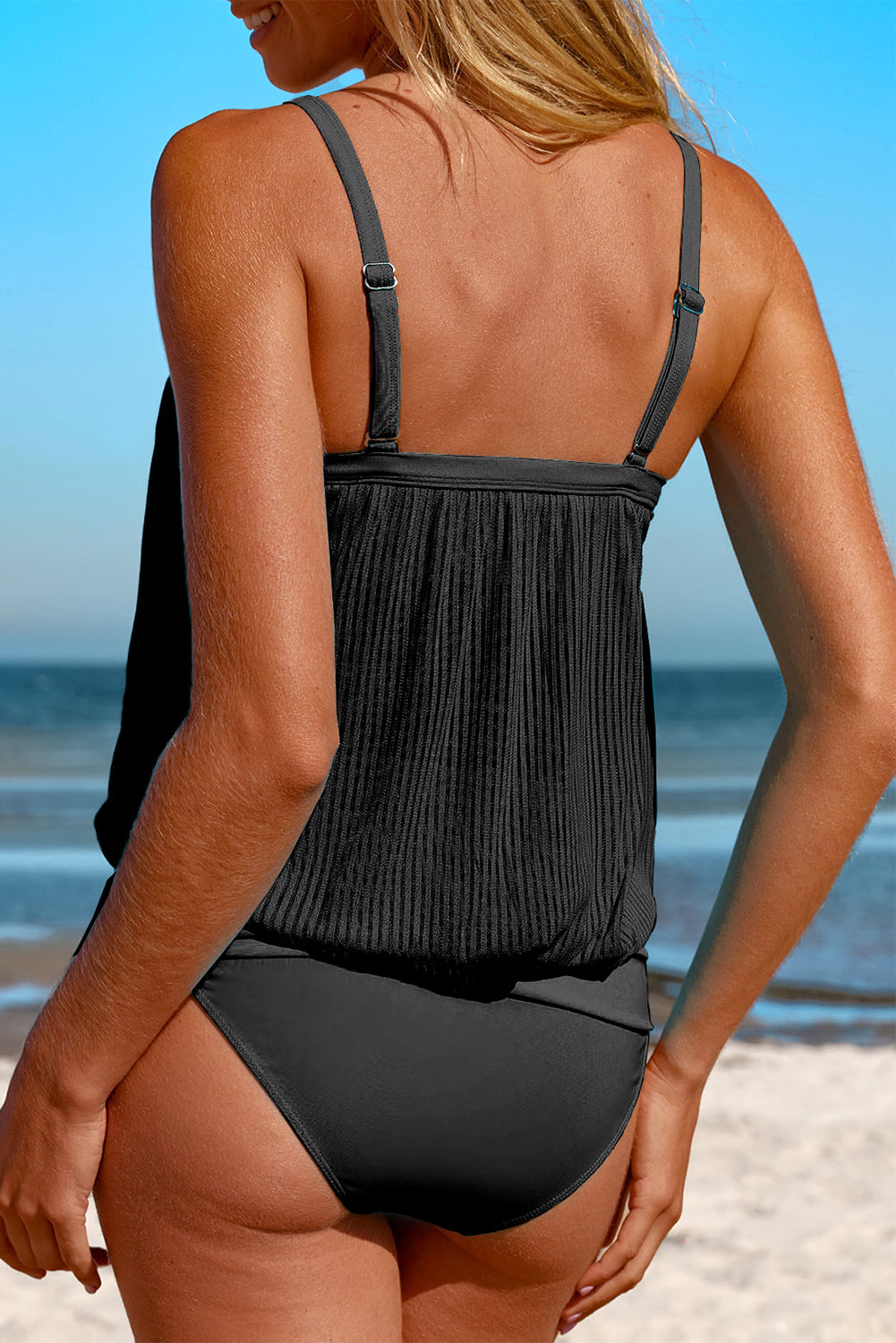 Striking black striped tankini with a chic knotted hem