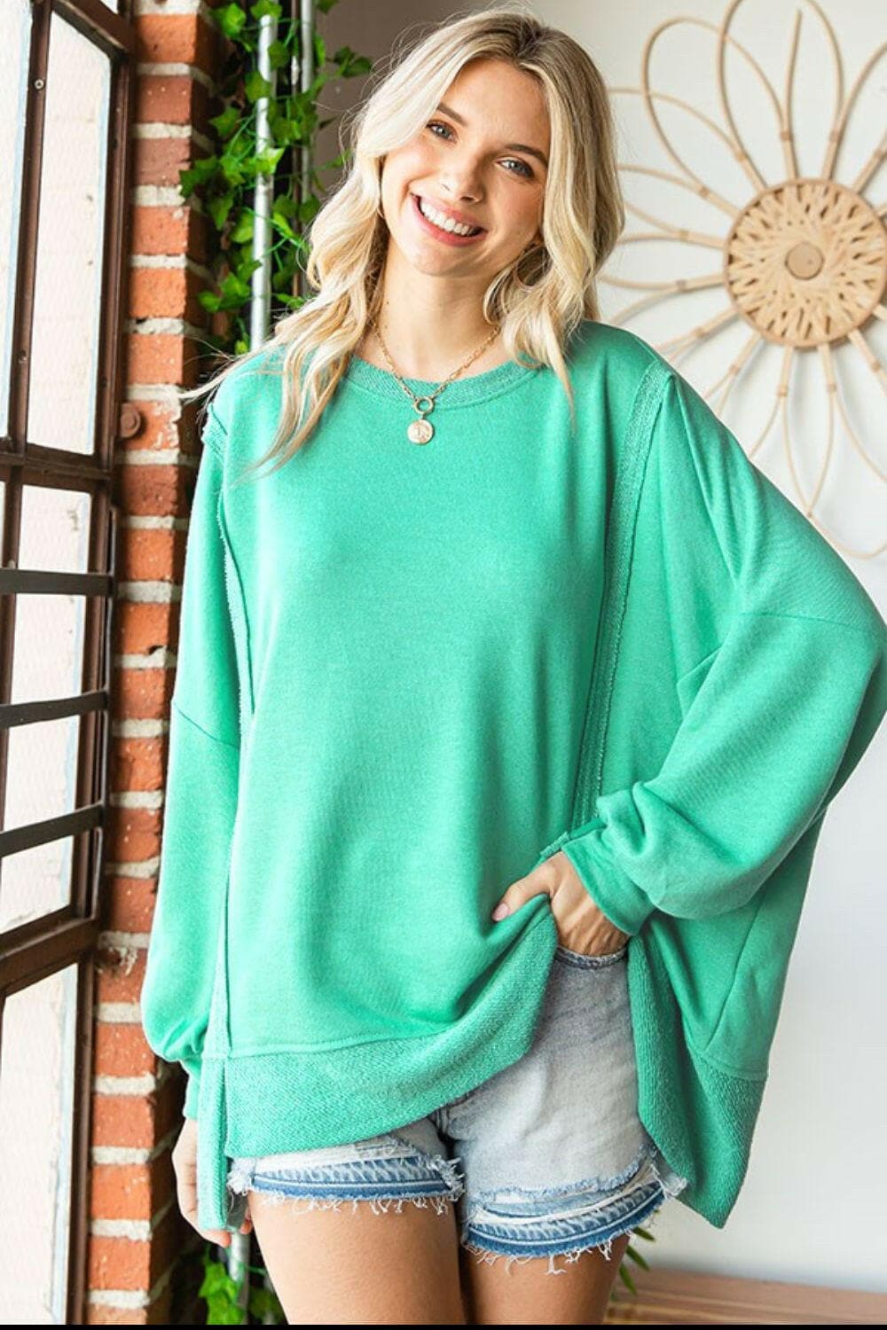 First Love Exposed Seam Round Neck Dropped Shoulder Blouse.