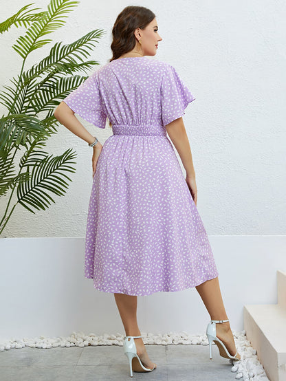 Plus Size Printed Smocked Waist Surplice Dress.