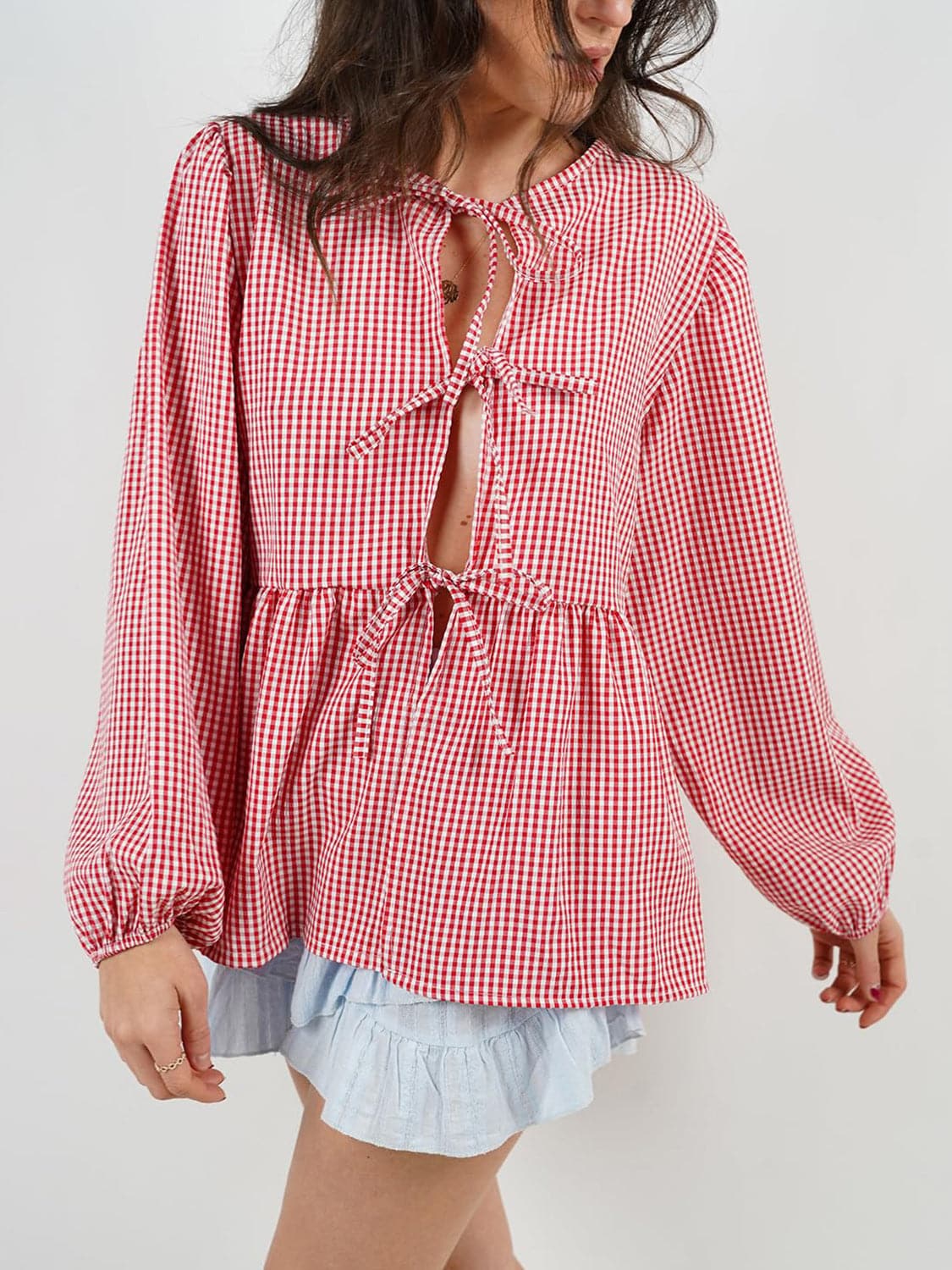 Tied Round Neck Long Sleeve Blouse.