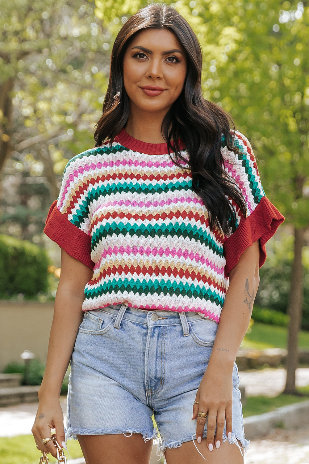 Colorful textured sweater with fiery red ruffle sleeves