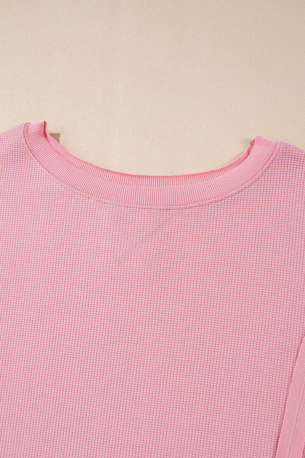 Cozy pink oversized sweatshirt with bishop sleeves and split detail