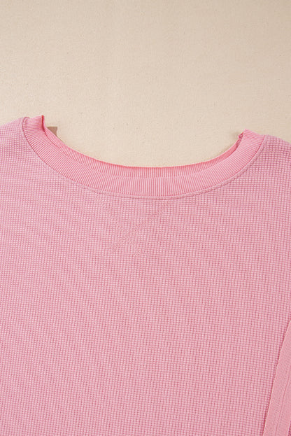 Cozy pink oversized sweatshirt with bishop sleeves and split detail