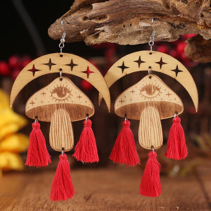 Celestial charm dangle earrings with tassel accents