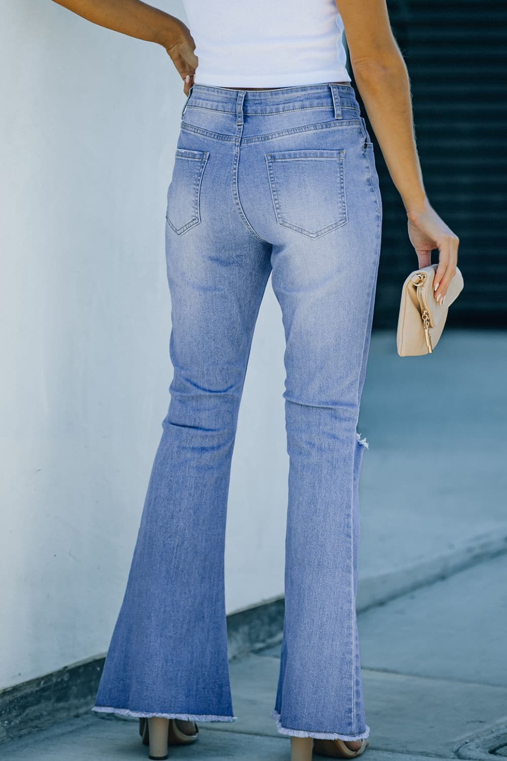 Button-Fly Distressed Raw Hem Flare Jeans.