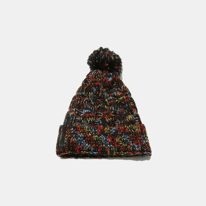 Cozy cable-knit beanie with playful pompom