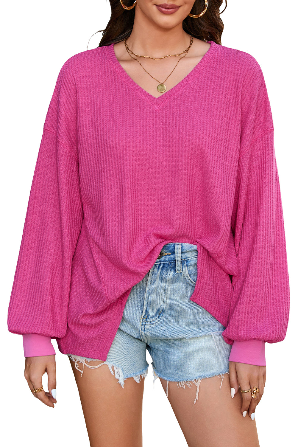 Chic bright pink waffle knit V-neck blouse with drop shoulders