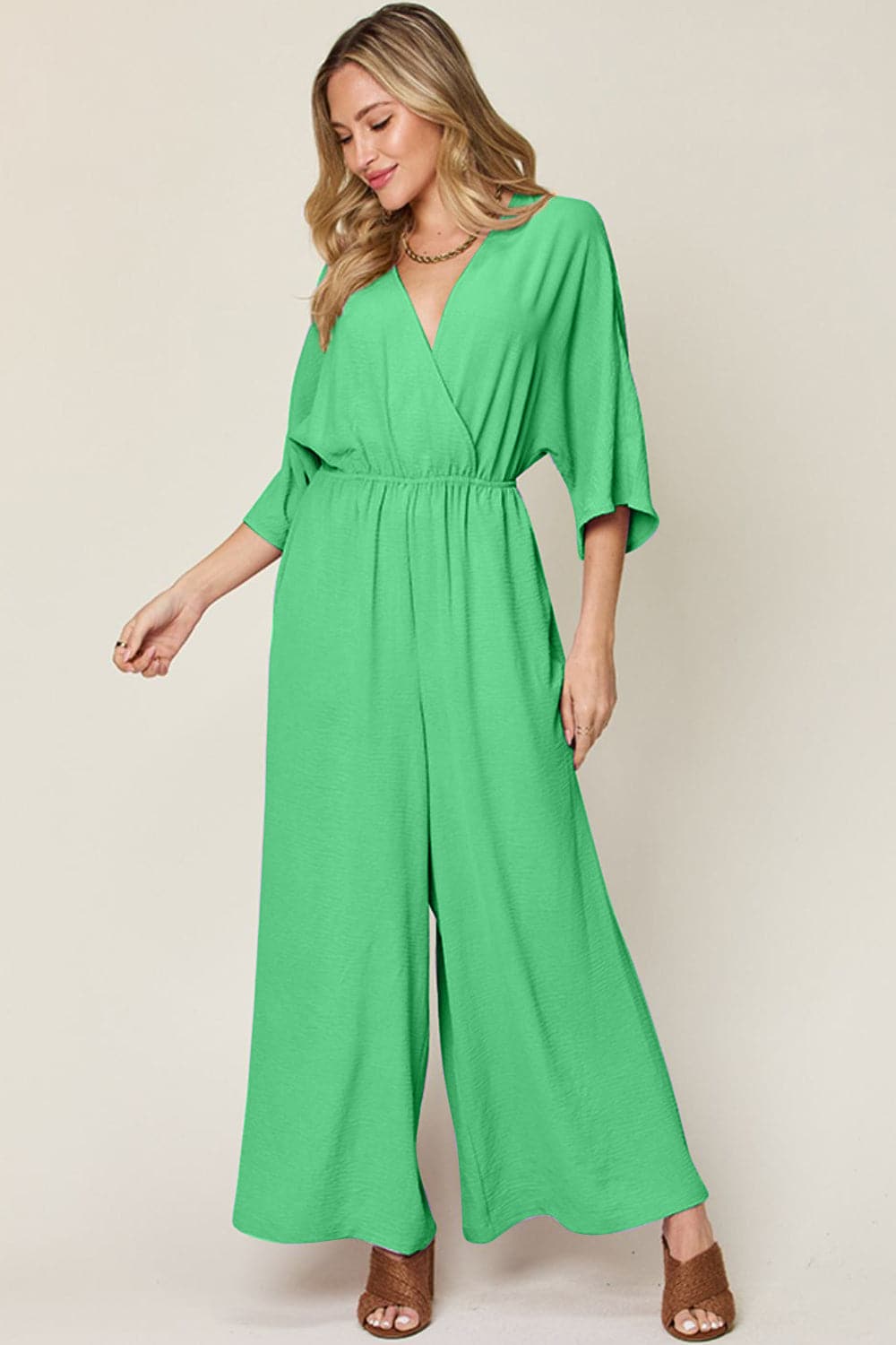 Double Take Full Size Surplice Wide Leg Jumpsuit with Pockets.