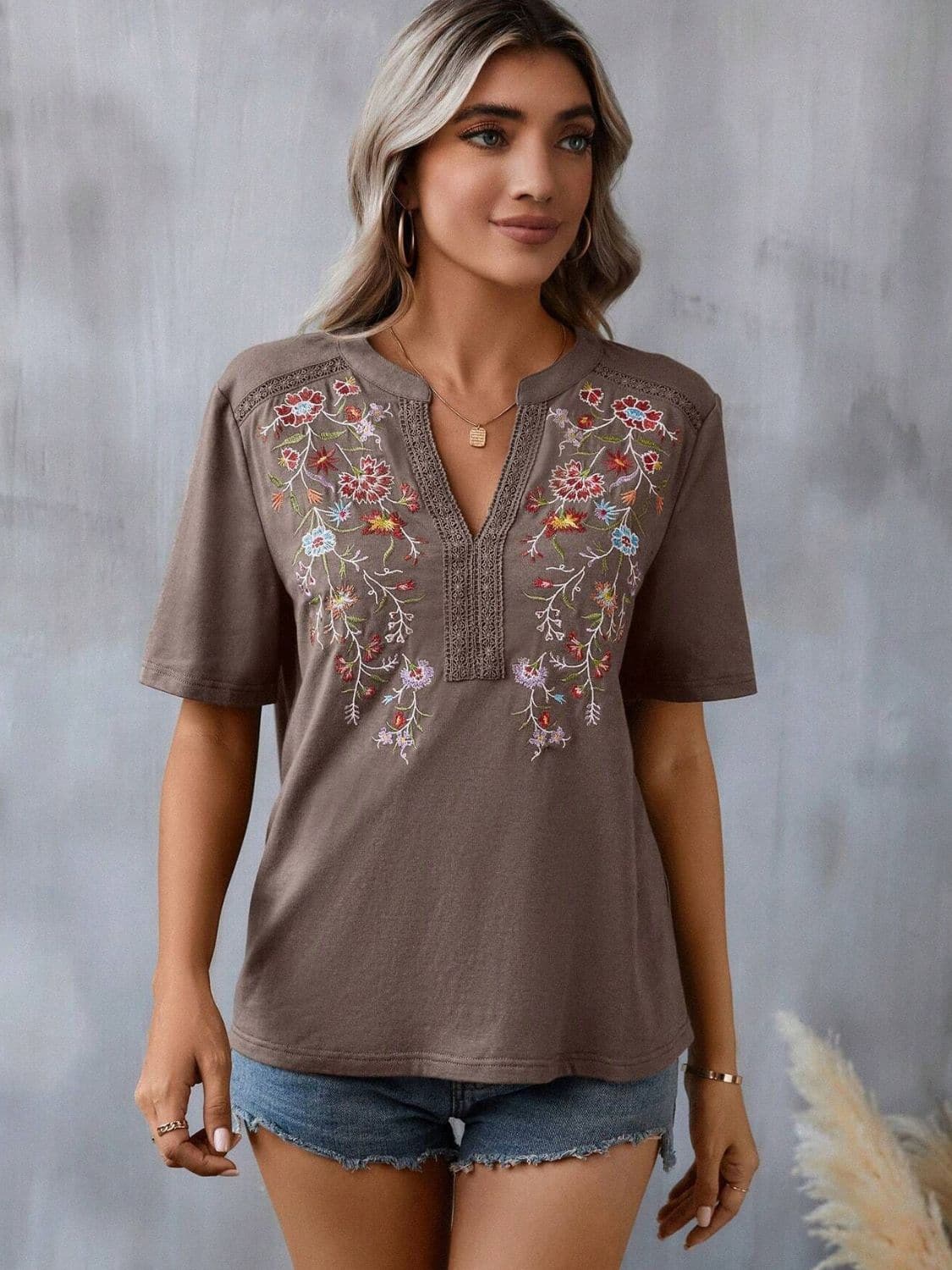 Embroidered Notched Short Sleeve T-Shirt.