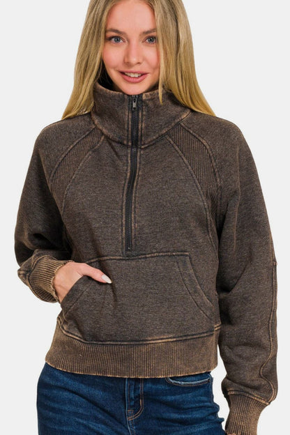 Acid wash half zip fleece pullover with kangaroo pocket, stylish and cozy layering piece.