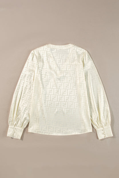 Chic oatmeal jacquard blouse with v-neck and bishop sleeves