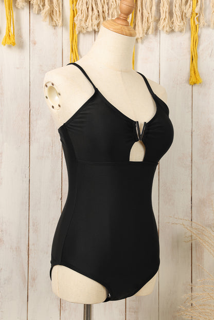 Chic black one-piece swimsuit with metal V detail and adjustable straps