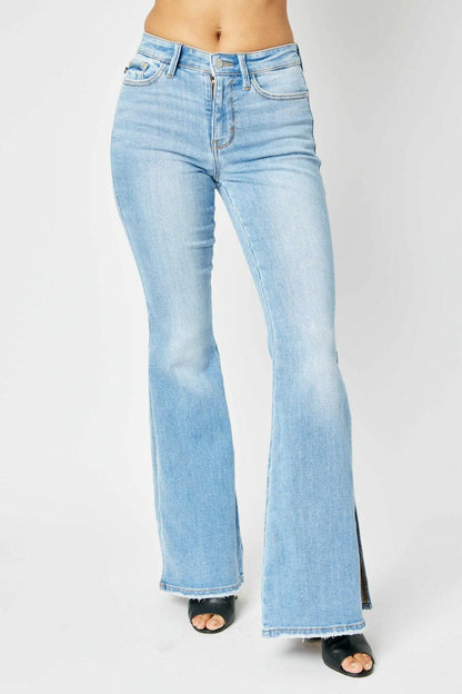 Judy Blue Full Size Mid Rise Raw Hem Slit Flare Jeans.