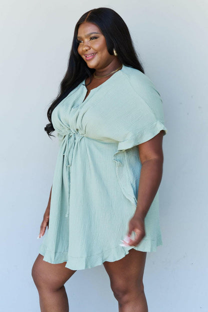 Ninexis Out Of Time Full Size Ruffle Hem Dress with Drawstring WaistbaExperience Effortless Elegance with the Ninexis Out Of Time Full Size Ruffle Hem Dress in Light Sage. This stunning dress is crafted from 100% cotton, providing a soLove Salve Time Full Size Ruffle Hem DressTIKTOK