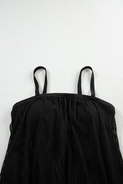 Striking black striped tankini with a chic knotted hem