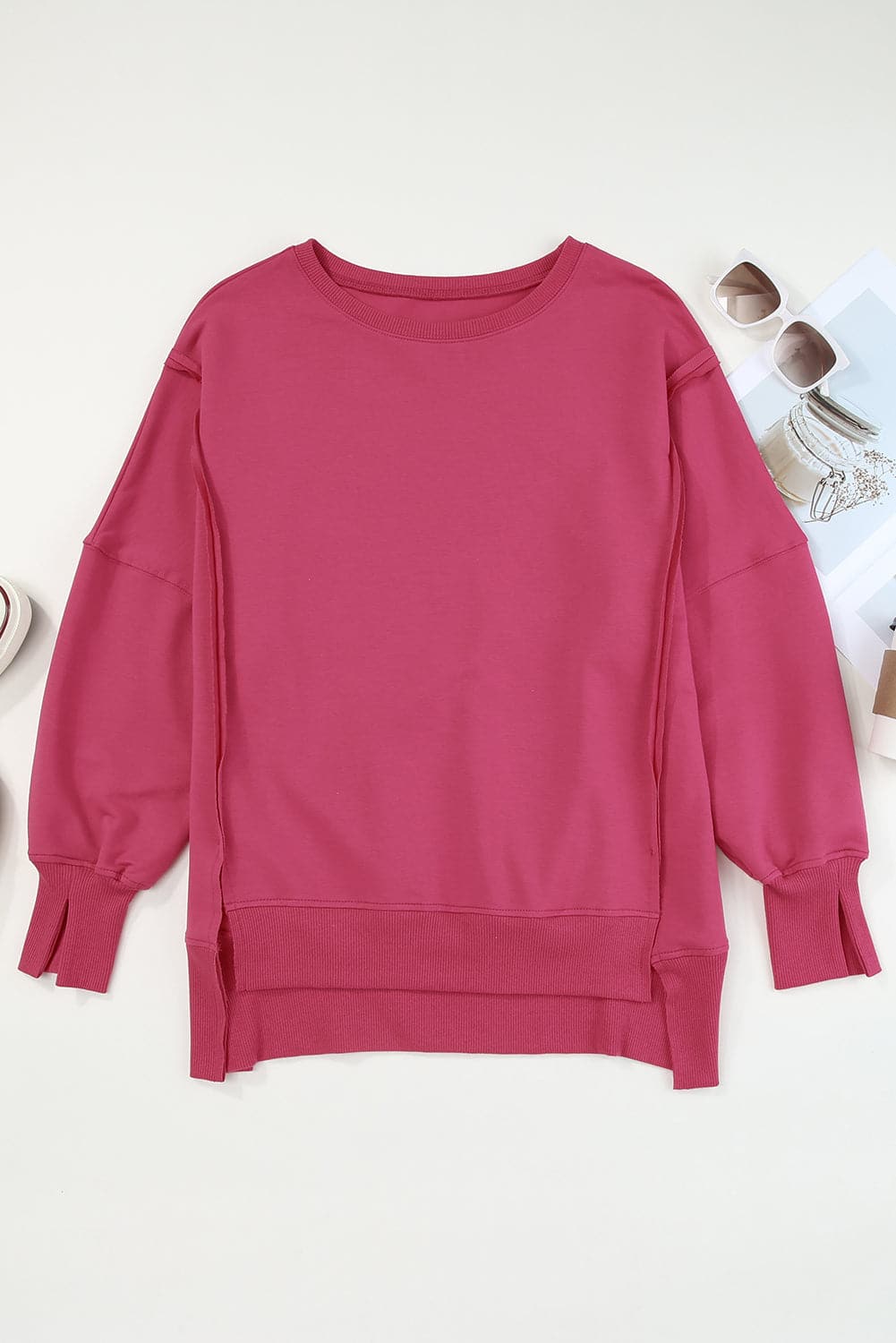 Slit Exposed Seam Round Neck Sweatshirt.