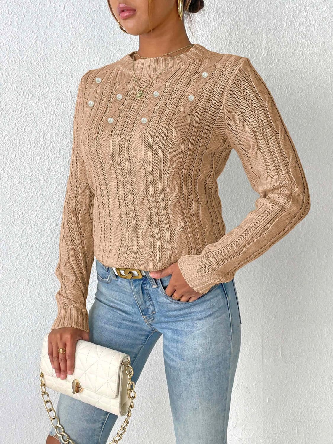 Cozy cable-knit long sleeve sweater with round neckline