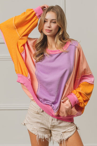 BiBi Color Block Exposed Seam Sweatshirt with Pockets.