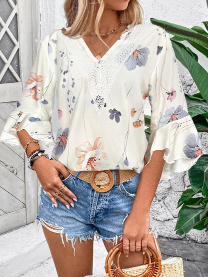 Ruffled Printed V-Neck Half Sleeve Blouse.