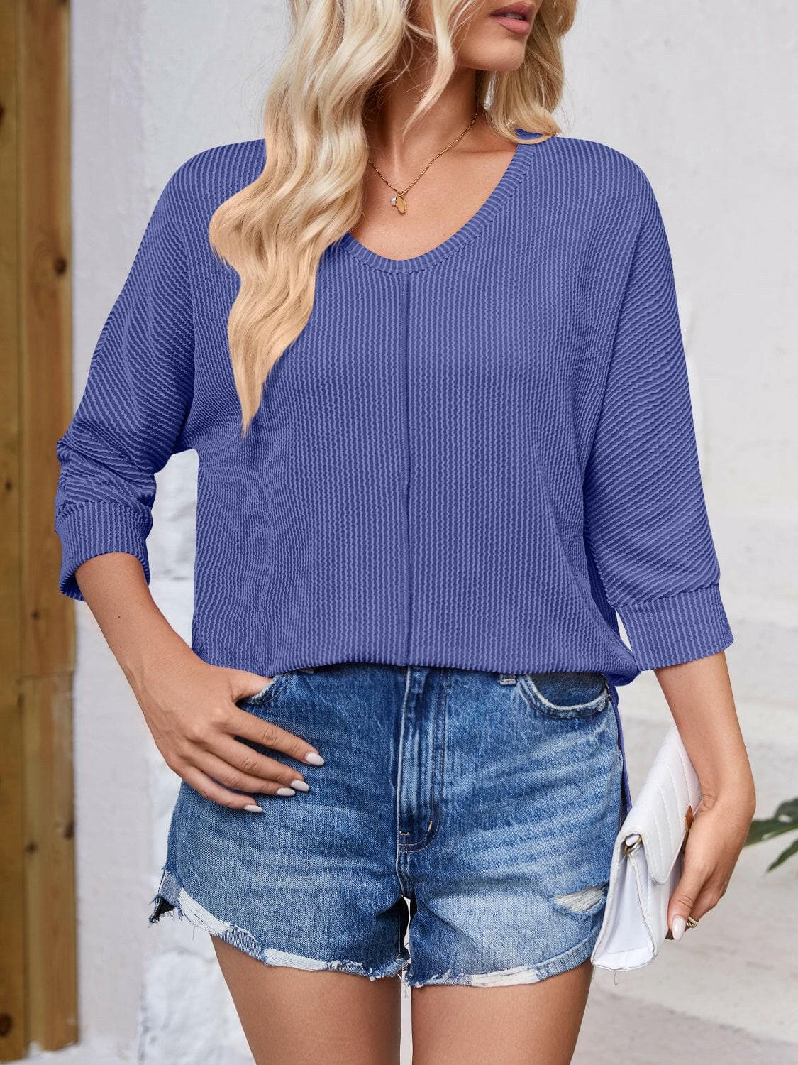 Textured Round Neck Three-Quarter Sleeve Blouse.