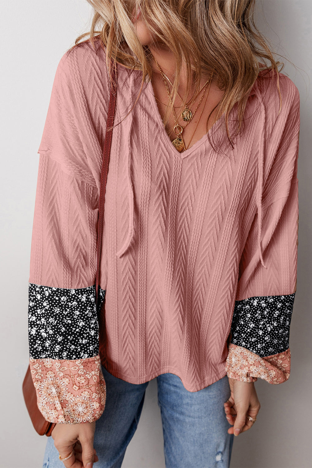 Dusty pink floral patchwork v-neck blouse with textured knit and drawstring detail