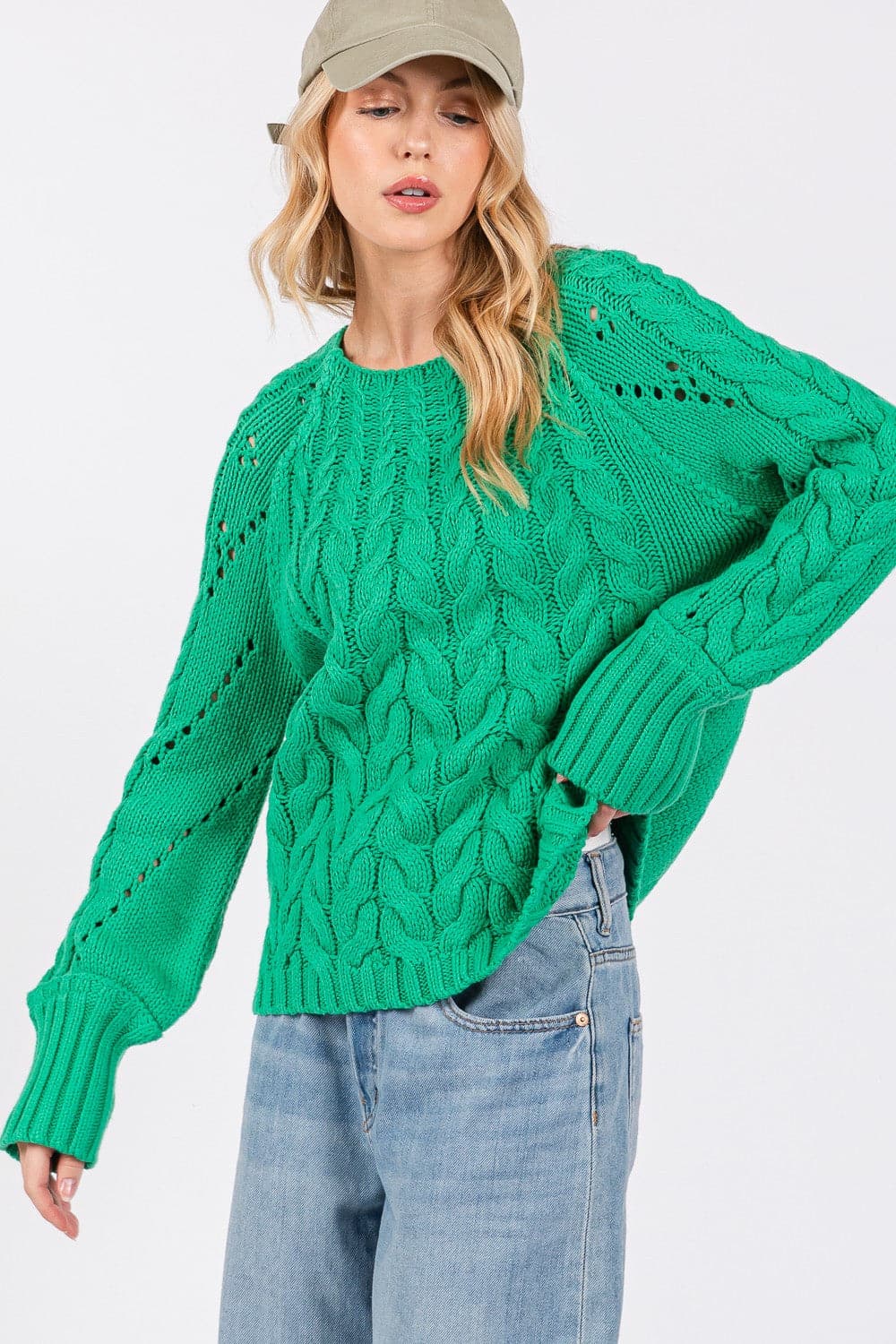 Cozy cable knit oversized sweater with boat neckline