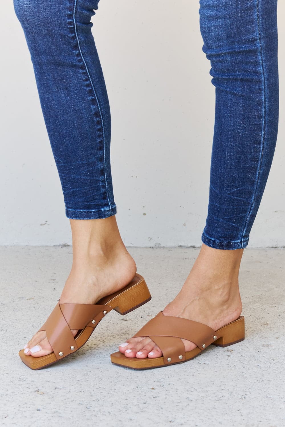 Weeboo Step Into Summer Criss Cross Wooden Clog Mule in Brown.